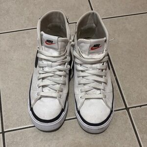 Nike White and Black High-Top Sneakers with Red Logo